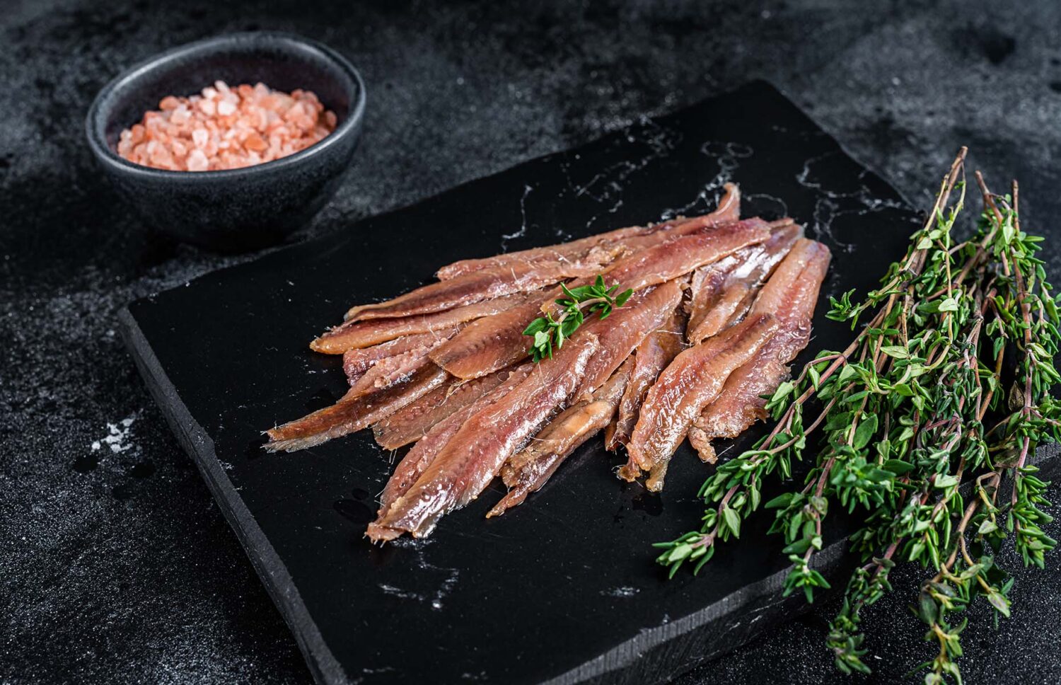 Anchovies,Fish,Fillet,In,Olive,Oil.,Black,Background.,Top,View Anchovies,Fish,Fillet,In,Olive,Oil.,Black,Background.,Top,View