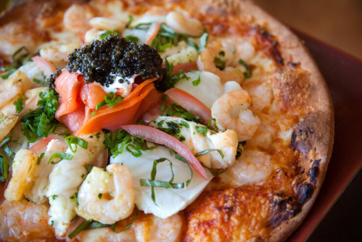 The $437 pizza with Russian Ossetra caviar and Lobster Thermidor.